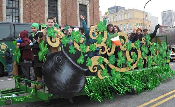 St. Mark School students wave to the crowd on Delaware Avenue during the annual St. Patrick's Day Parade. (Dan Cappellazzo/Staff Photographer)